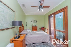 Casa em Condomínio à venda com 486m², 4 dormitórios, 3 suítes, 4 vagas, no bairro Cavalhada em PORTO ALEGRE