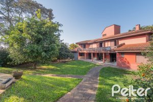 Casa em Condomínio à venda com 486m², 4 dormitórios, 3 suítes, 4 vagas, no bairro Cavalhada em PORTO ALEGRE