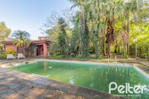 Casa em Condomínio à venda com 486m², 4 dormitórios, 3 suítes, 4 vagas, no bairro Cavalhada em PORTO ALEGRE