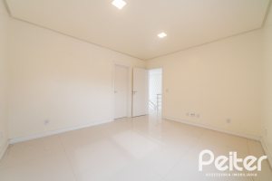 Casa em Condomínio à venda com 294m², 5 dormitórios, 5 suítes, 4 vagas, no bairro Terra Ville em PORTO ALEGRE