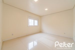 Casa em Condomínio à venda com 294m², 5 dormitórios, 5 suítes, 4 vagas, no bairro Terra Ville em PORTO ALEGRE