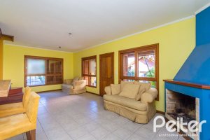 Casa em Condomínio à venda com 174m², 3 dormitórios, 1 suíte, 2 vagas, no bairro Guarujá em Porto Alegre