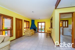 Casa em Condomínio à venda com 174m², 3 dormitórios, 1 suíte, 2 vagas, no bairro Guarujá em Porto Alegre