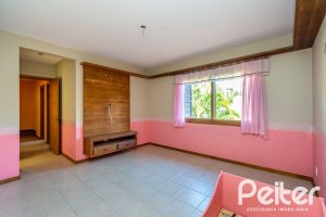 Casa em Condomínio à venda com 174m², 3 dormitórios, 1 suíte, 2 vagas, no bairro Guarujá em Porto Alegre