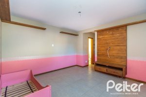 Casa em Condomínio à venda com 174m², 3 dormitórios, 1 suíte, 2 vagas, no bairro Guarujá em Porto Alegre