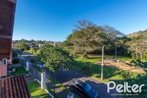 Casa em Condomínio à venda com 174m², 3 dormitórios, 1 suíte, 2 vagas, no bairro Guarujá em Porto Alegre