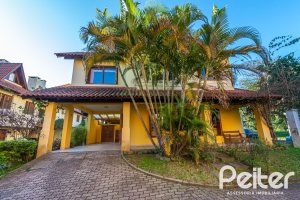 Casa em Condomínio à venda com 174m², 3 dormitórios, 1 suíte, 2 vagas, no bairro Guarujá em Porto Alegre