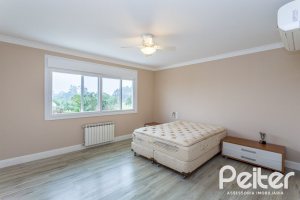 Casa em Condomínio à venda com 615m², 4 dormitórios, 4 suítes, 6 vagas, no bairro Terra Ville em PORTO ALEGRE