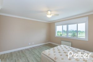 Casa em Condomínio à venda com 615m², 4 dormitórios, 4 suítes, 6 vagas, no bairro Terra Ville em PORTO ALEGRE