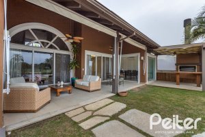 Casa em Condomínio à venda com 615m², 4 dormitórios, 4 suítes, 6 vagas, no bairro Terra Ville em PORTO ALEGRE