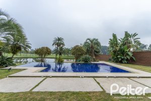 Casa em Condomínio à venda com 615m², 4 dormitórios, 4 suítes, 6 vagas, no bairro Terra Ville em PORTO ALEGRE