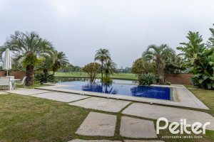 Casa em Condomínio à venda com 615m², 4 dormitórios, 4 suítes, 6 vagas, no bairro Terra Ville em PORTO ALEGRE