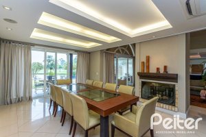 Casa em Condomínio à venda com 615m², 4 dormitórios, 4 suítes, 6 vagas, no bairro Terra Ville em PORTO ALEGRE