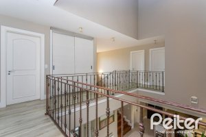 Casa em Condomínio à venda com 615m², 4 dormitórios, 4 suítes, 6 vagas, no bairro Terra Ville em PORTO ALEGRE