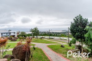 Casa em Condomínio à venda com 150m², 4 dormitórios, 1 suíte, 2 vagas, no bairro Ipanema em PORTO ALEGRE