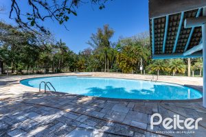 Casa em Condomínio à venda com 294m², 5 dormitórios, 5 suítes, 4 vagas, no bairro Terra Ville em PORTO ALEGRE