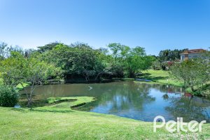 Casa em Condomínio à venda com 294m², 5 dormitórios, 5 suítes, 4 vagas, no bairro Terra Ville em PORTO ALEGRE