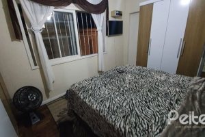 Casa à venda com 210m², 3 dormitórios, 1 suíte, 2 vagas, no bairro Guarujá em Porto Alegre