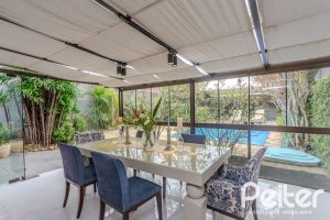 Casa à venda com 410m², 3 dormitórios, 3 suítes, 3 vagas, no bairro Ipanema em Porto Alegre