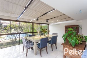 Casa à venda com 410m², 3 dormitórios, 3 suítes, 3 vagas, no bairro Ipanema em Porto Alegre