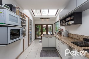Casa à venda com 410m², 3 dormitórios, 3 suítes, 3 vagas, no bairro Ipanema em Porto Alegre