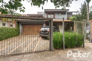 Casa à venda com 410m², 3 dormitórios, 3 suítes, 3 vagas, no bairro Ipanema em Porto Alegre