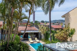 Casa à venda com 410m², 3 dormitórios, 3 suítes, 3 vagas, no bairro Ipanema em Porto Alegre