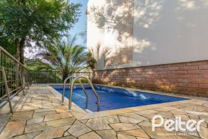 Casa em Condomínio à venda com 270m², 3 dormitórios, 1 suíte, 3 vagas, no bairro Jardim Isabel em PORTO ALEGRE