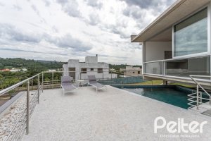 Casa em Condomínio à venda com 315m², 3 dormitórios, 3 suítes, 3 vagas, no bairro Alphaville em PORTO ALEGRE