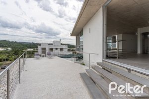 Casa em Condomínio à venda com 315m², 3 dormitórios, 3 suítes, 3 vagas, no bairro Alphaville em PORTO ALEGRE