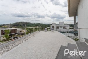 Casa em Condomínio à venda com 315m², 3 dormitórios, 3 suítes, 3 vagas, no bairro Alphaville em PORTO ALEGRE