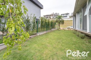 Casa em Condomínio à venda com 315m², 3 dormitórios, 3 suítes, 3 vagas, no bairro Alphaville em PORTO ALEGRE