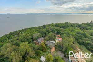 Casa à venda com 352m², 3 dormitórios, 1 suíte, 4 vagas, no bairro Belém Novo em Porto Alegre