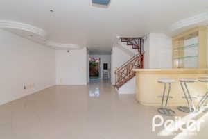 Casa em Condomínio à venda com 252m², 3 dormitórios, 2 suítes, 3 vagas, no bairro Vila Assunção em Porto Alegre