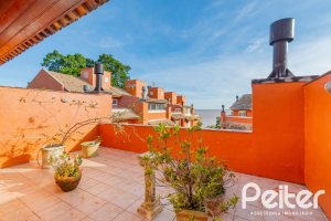 Casa em Condomínio à venda com 252m², 3 dormitórios, 2 suítes, 3 vagas, no bairro Vila Assunção em Porto Alegre