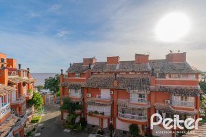 Casa em Condomínio à venda com 252m², 3 dormitórios, 2 suítes, 3 vagas, no bairro Vila Assunção em Porto Alegre