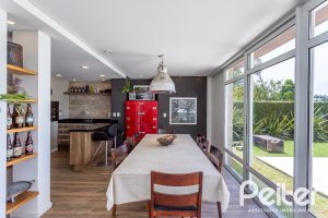 Casa em Condomínio à venda com 418m², 3 dormitórios, 3 suítes, 6 vagas, no bairro Terra Ville em PORTO ALEGRE