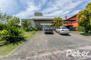 Casa em Condomínio à venda com 418m², 3 dormitórios, 3 suítes, 6 vagas, no bairro Terra Ville em PORTO ALEGRE