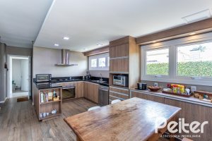 Casa em Condomínio à venda com 418m², 3 dormitórios, 3 suítes, 6 vagas, no bairro Terra Ville em PORTO ALEGRE