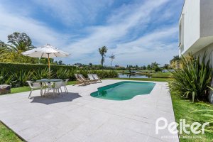 Casa em Condomínio à venda com 418m², 3 dormitórios, 3 suítes, 6 vagas, no bairro Terra Ville em PORTO ALEGRE