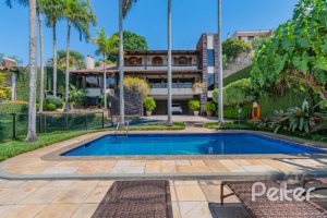 Casa à venda com 430m², 3 dormitórios, 2 suítes, 4 vagas, no bairro Vila Assunção em Porto Alegre