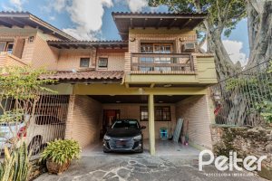 Casa à venda com 176m², 3 dormitórios, 1 suíte, 4 vagas, no bairro Jardim Isabel em Porto Alegre