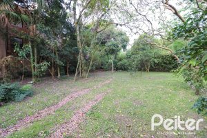 Casa à venda com 523m², 4 dormitórios, 2 suítes, 4 vagas, no bairro Tristeza em Porto Alegre