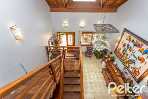 Casa em Condomínio à venda com 560m², 5 dormitórios, 2 suítes, 5 vagas, no bairro Campo Novo em Porto Alegre