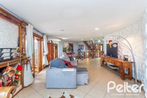 Casa em Condomínio à venda com 560m², 5 dormitórios, 2 suítes, 5 vagas, no bairro Campo Novo em Porto Alegre