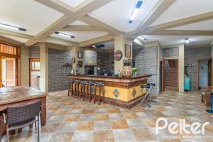 Casa em Condomínio à venda com 560m², 5 dormitórios, 2 suítes, 5 vagas, no bairro Campo Novo em Porto Alegre