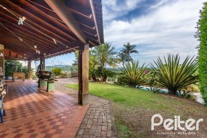 Casa em Condomínio à venda com 560m², 5 dormitórios, 2 suítes, 5 vagas, no bairro Campo Novo em Porto Alegre