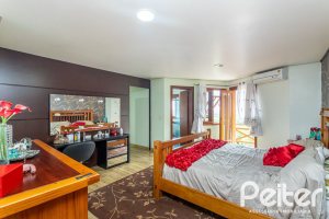 Casa em Condomínio à venda com 560m², 5 dormitórios, 2 suítes, 5 vagas, no bairro Campo Novo em Porto Alegre