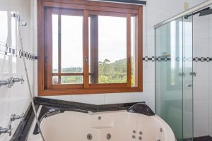 Casa em Condomínio à venda com 560m², 5 dormitórios, 2 suítes, 5 vagas, no bairro Campo Novo em Porto Alegre