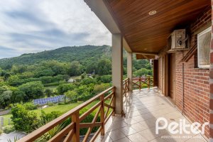 Casa em Condomínio à venda com 560m², 5 dormitórios, 2 suítes, 5 vagas, no bairro Campo Novo em Porto Alegre